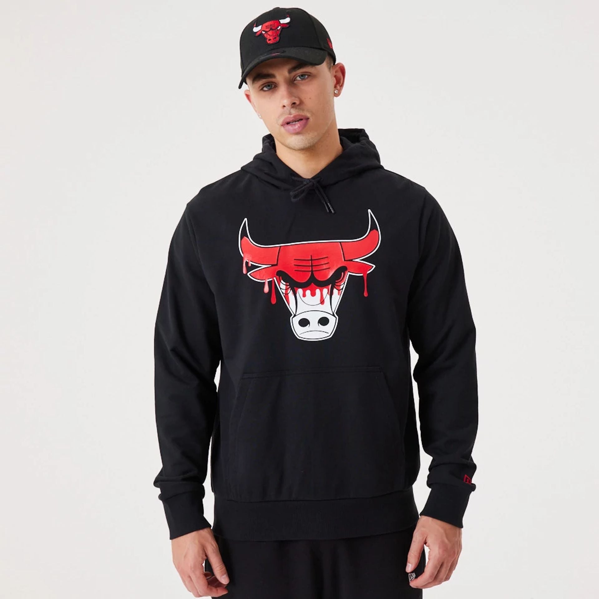 The Male model is wearing Chicago Bulls NBA Drip Logo Black Pullover Hoodie 1