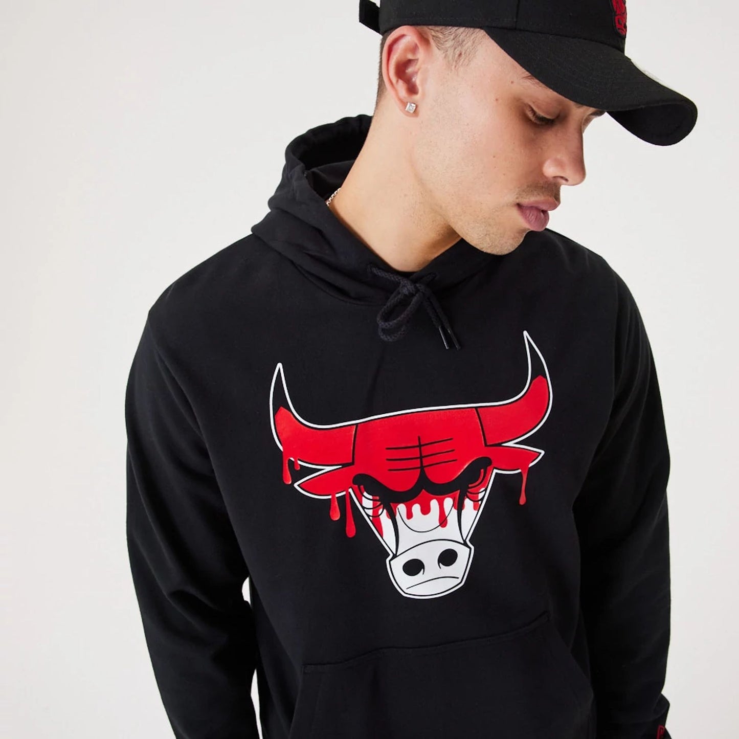 The Male model is wearing Chicago Bulls NBA Drip Logo Black Pullover Hoodie 2