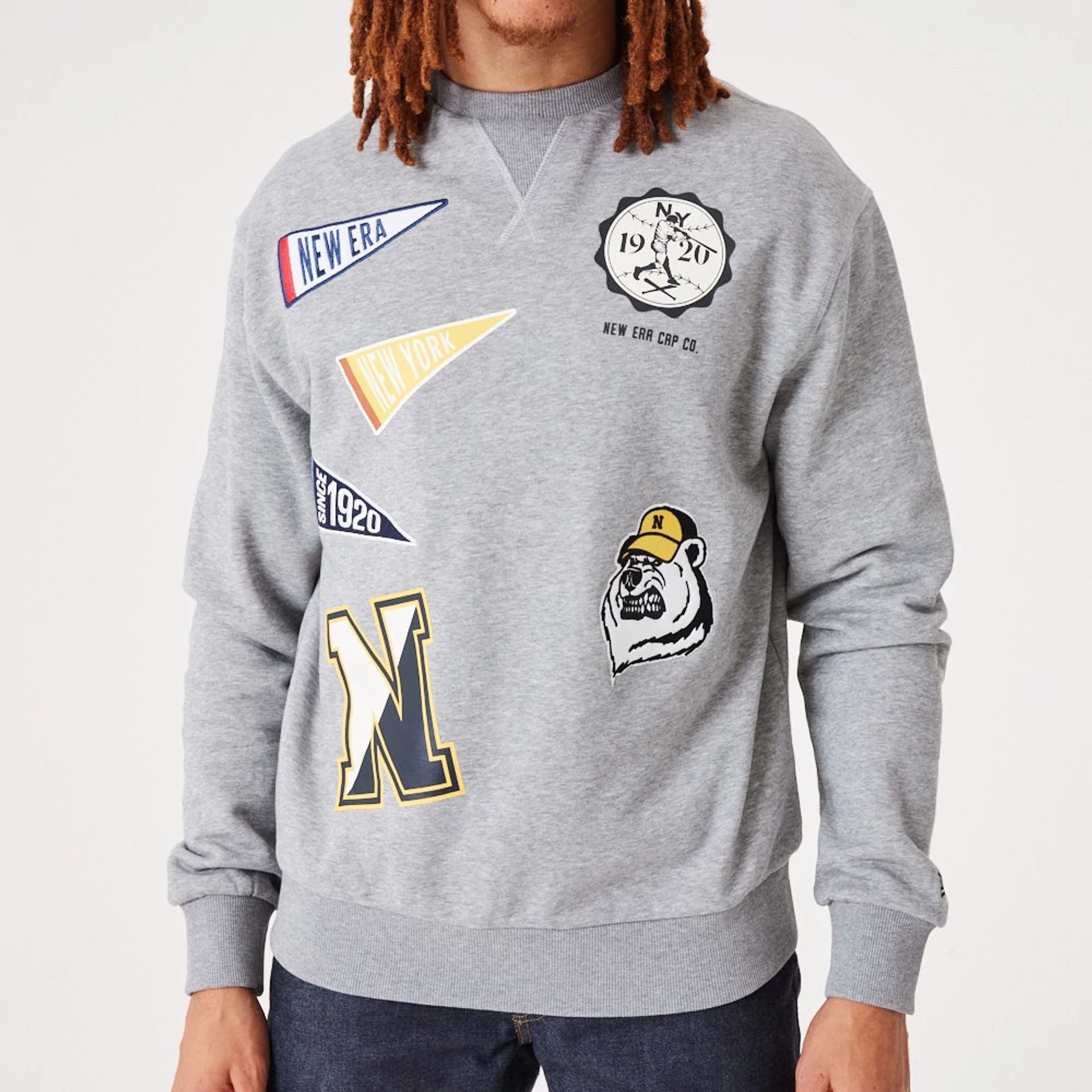 The Male model is wearing New Era Heritage Badge Medium Grey Crew Neck Sweatshirt 3