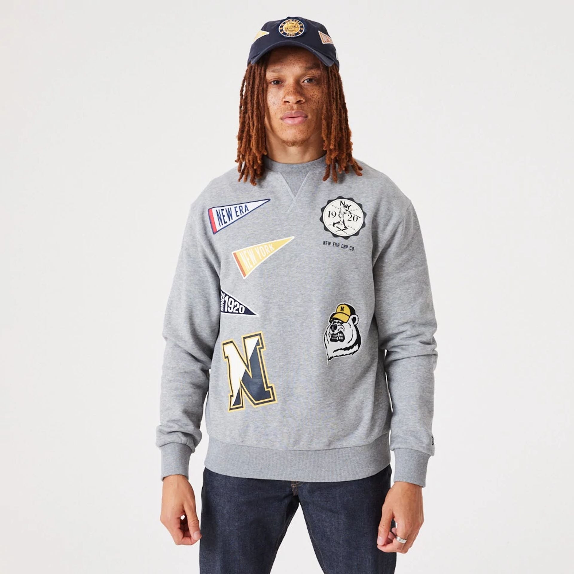 The Male model is wearing New Era Heritage Badge Medium Grey Crew Neck Sweatshirt 1