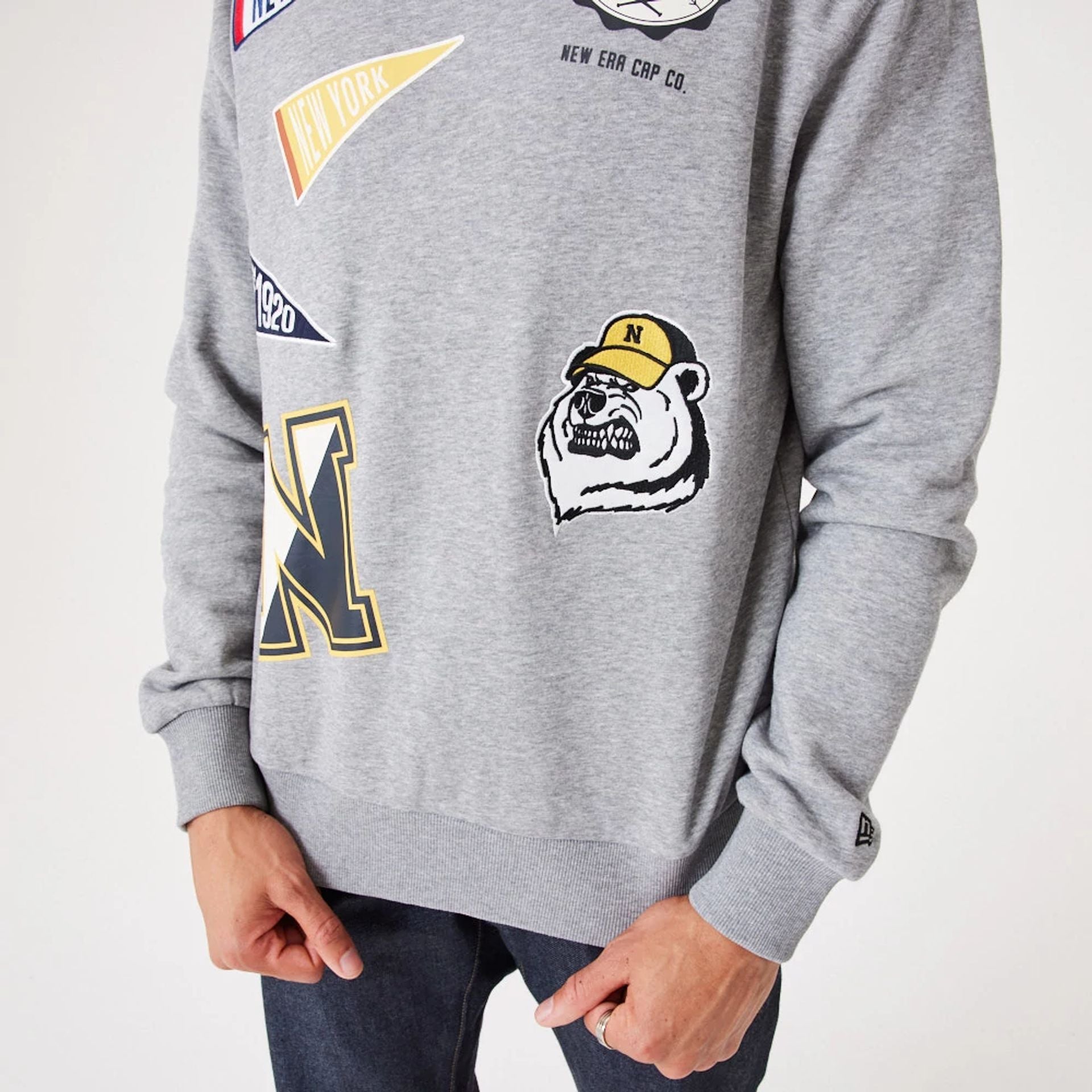 The Male model is wearing New Era Heritage Badge Medium Grey Crew Neck Sweatshirt 6