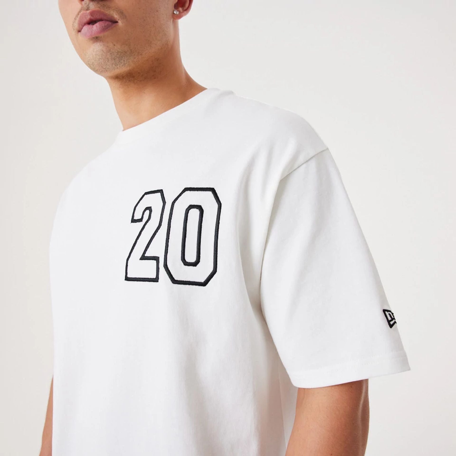 The Male model is wearing New Era Contemporary White Oversized T-Shirt 6