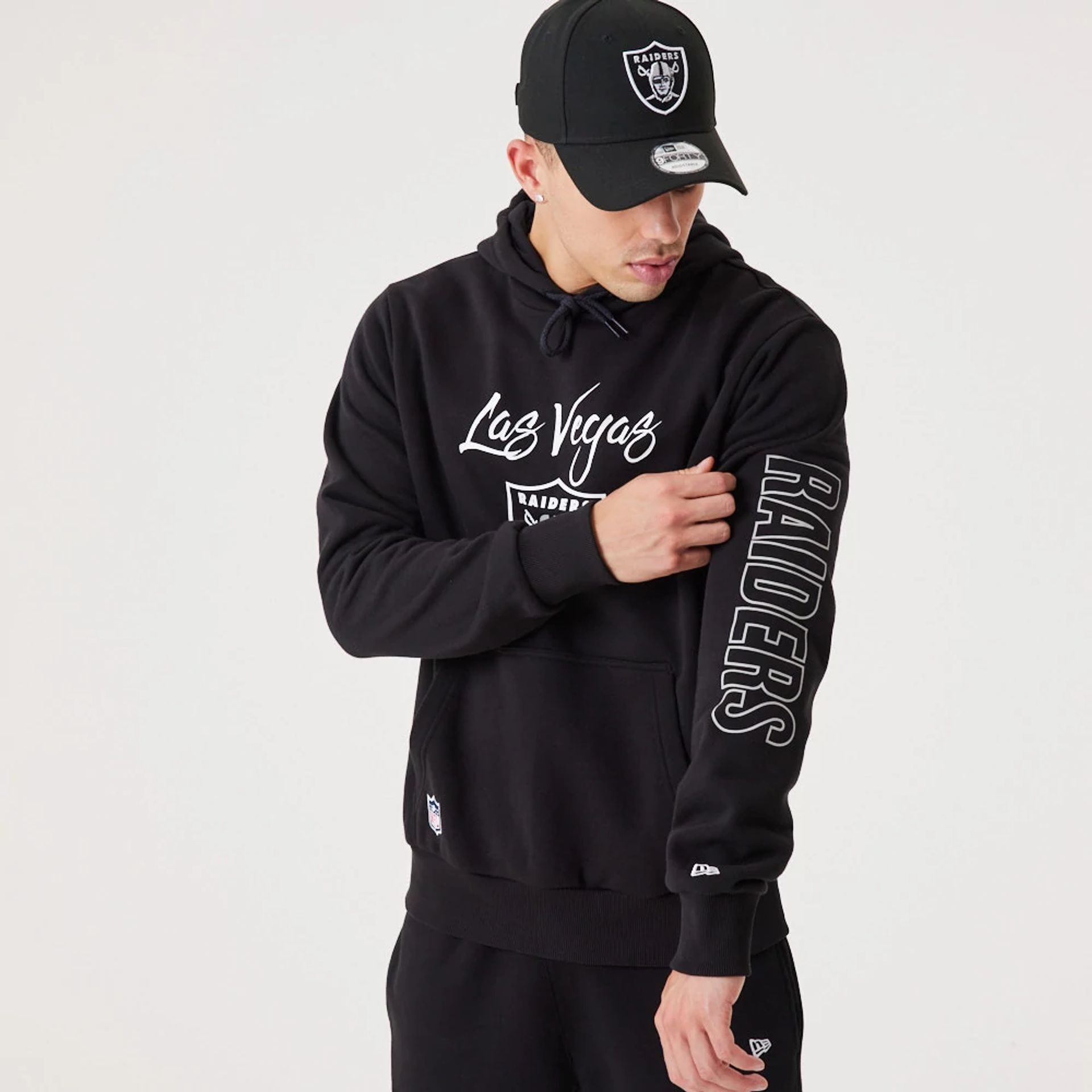 The Male model is wearing Las Vegas Raiders NFL Script Black Pullover Hoodie 6