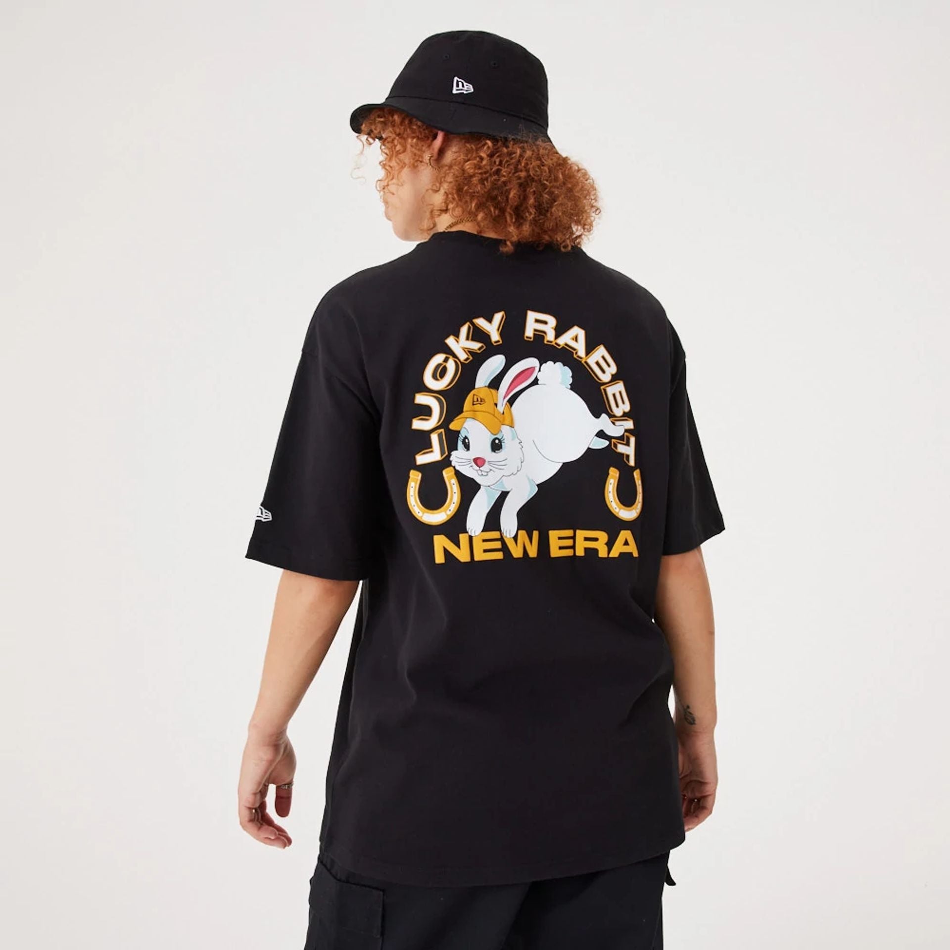 The Male model is wearing New Era Lucky Rabbit Black Oversized T-Shirt 6