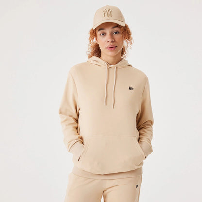 The Male model is wearing New Era Essential Light Beige Pullover Hoodie 3