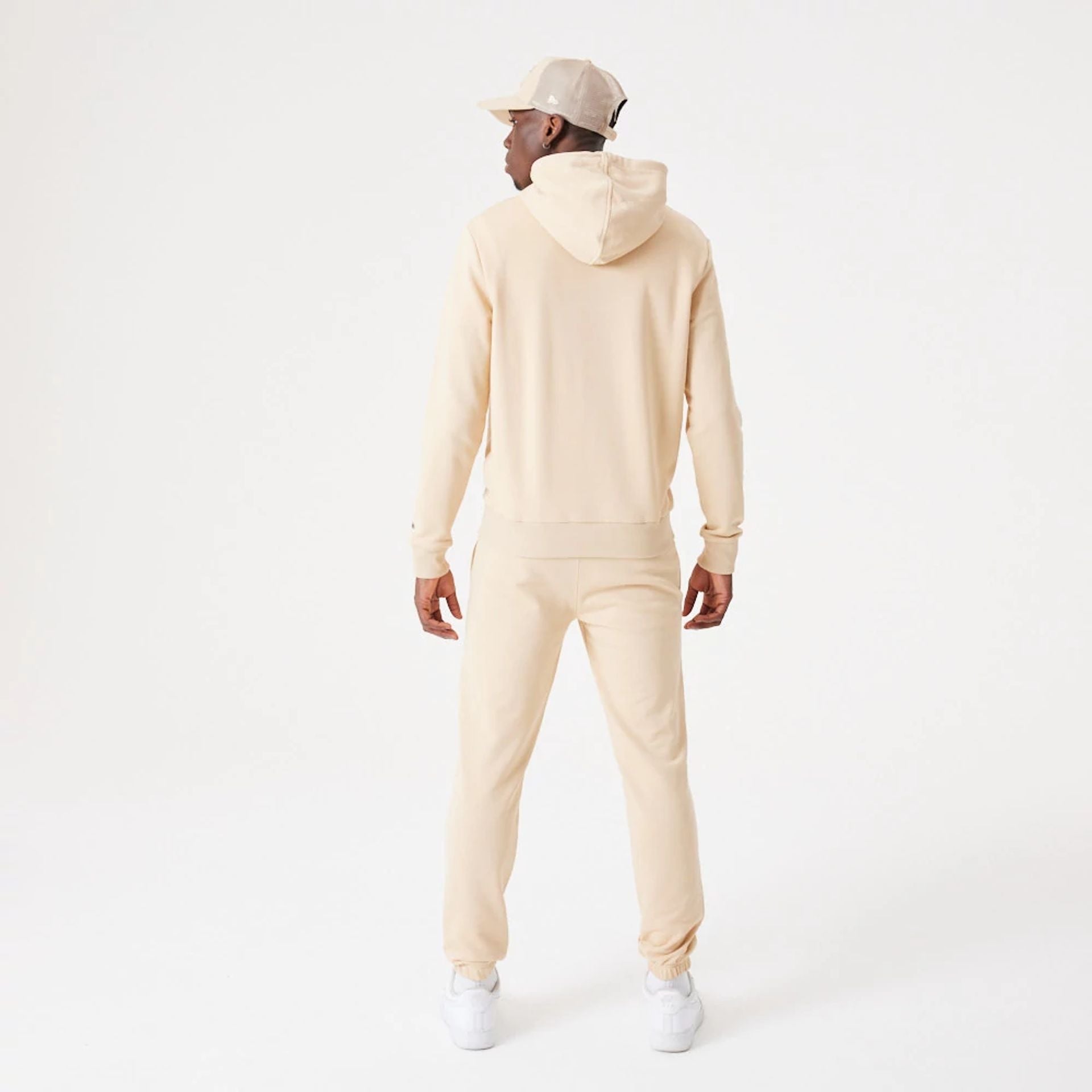 The Male model is wearing New Era Essential Light Beige Pullover Hoodie 10