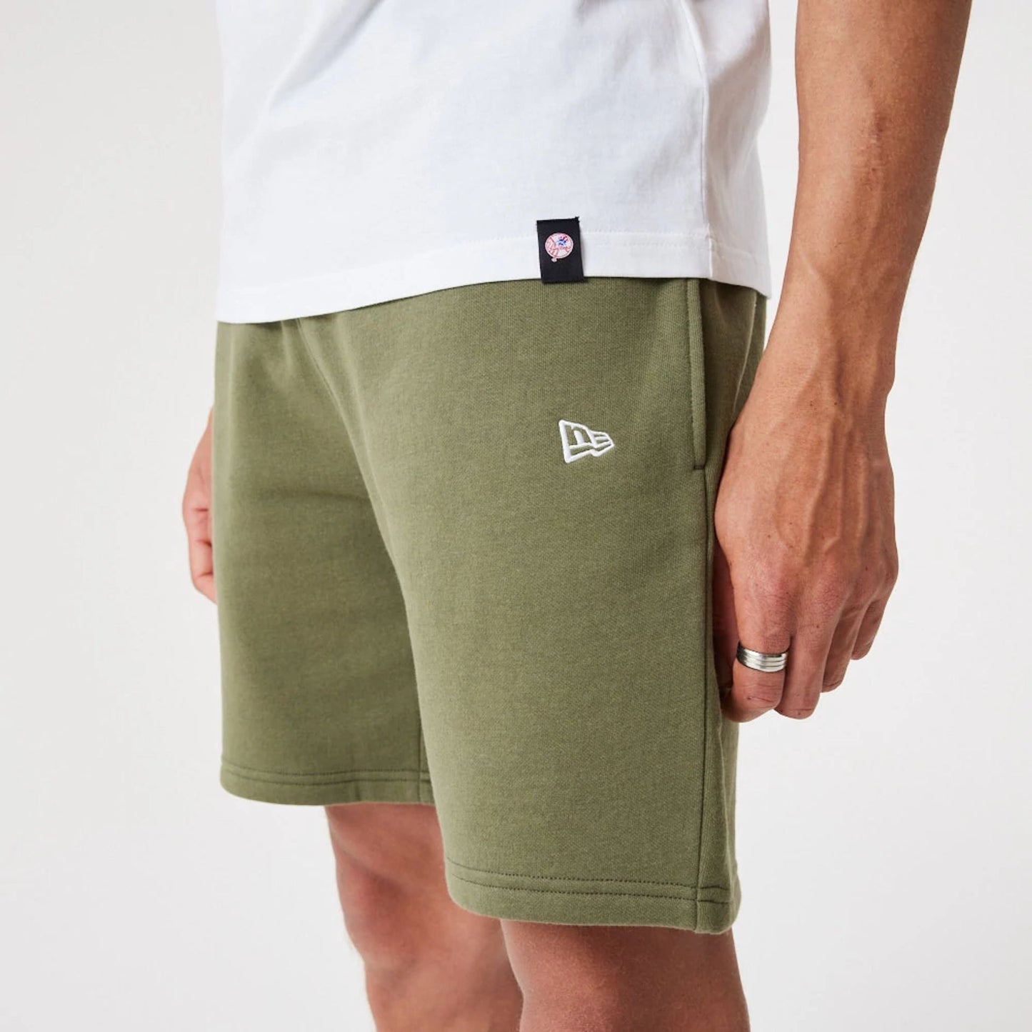 The Male model is wearing New York Yankees MLB League Essential Medium Green Shorts 4