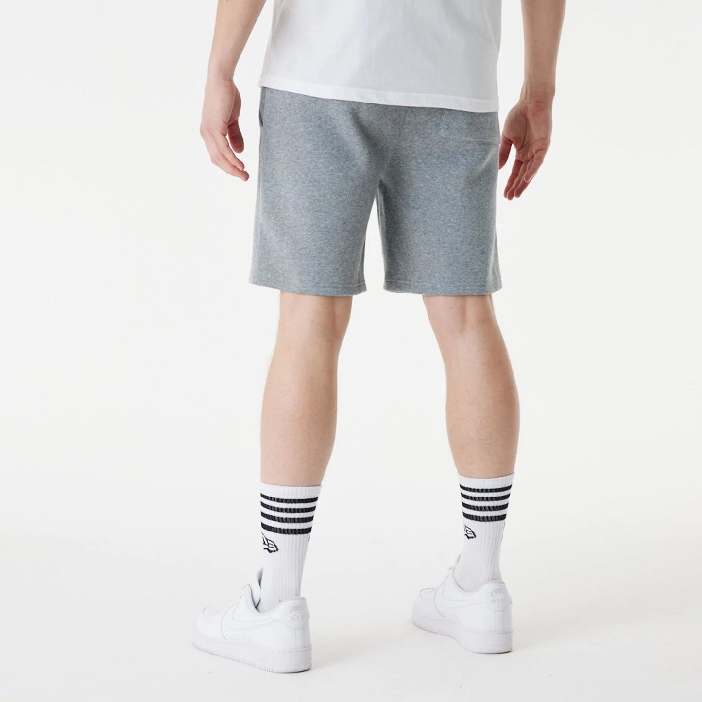 The Male model is wearing New Era Grey Essential Shorts 5