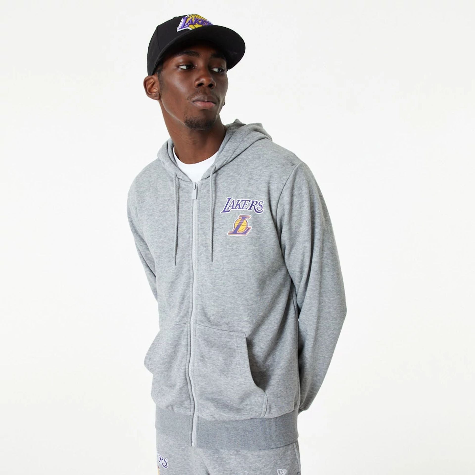 The Male model is wearing LA Lakers NBA Essentials Medium Grey Full Zip Hoodie 1