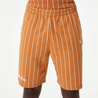 The Male model is wearing New Era Pinstripe Orange Shorts 3