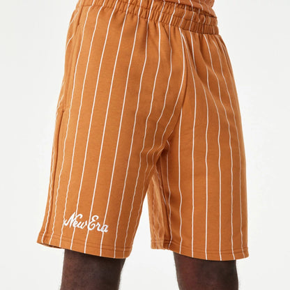 The Male model is wearing New Era Pinstripe Orange Shorts 1