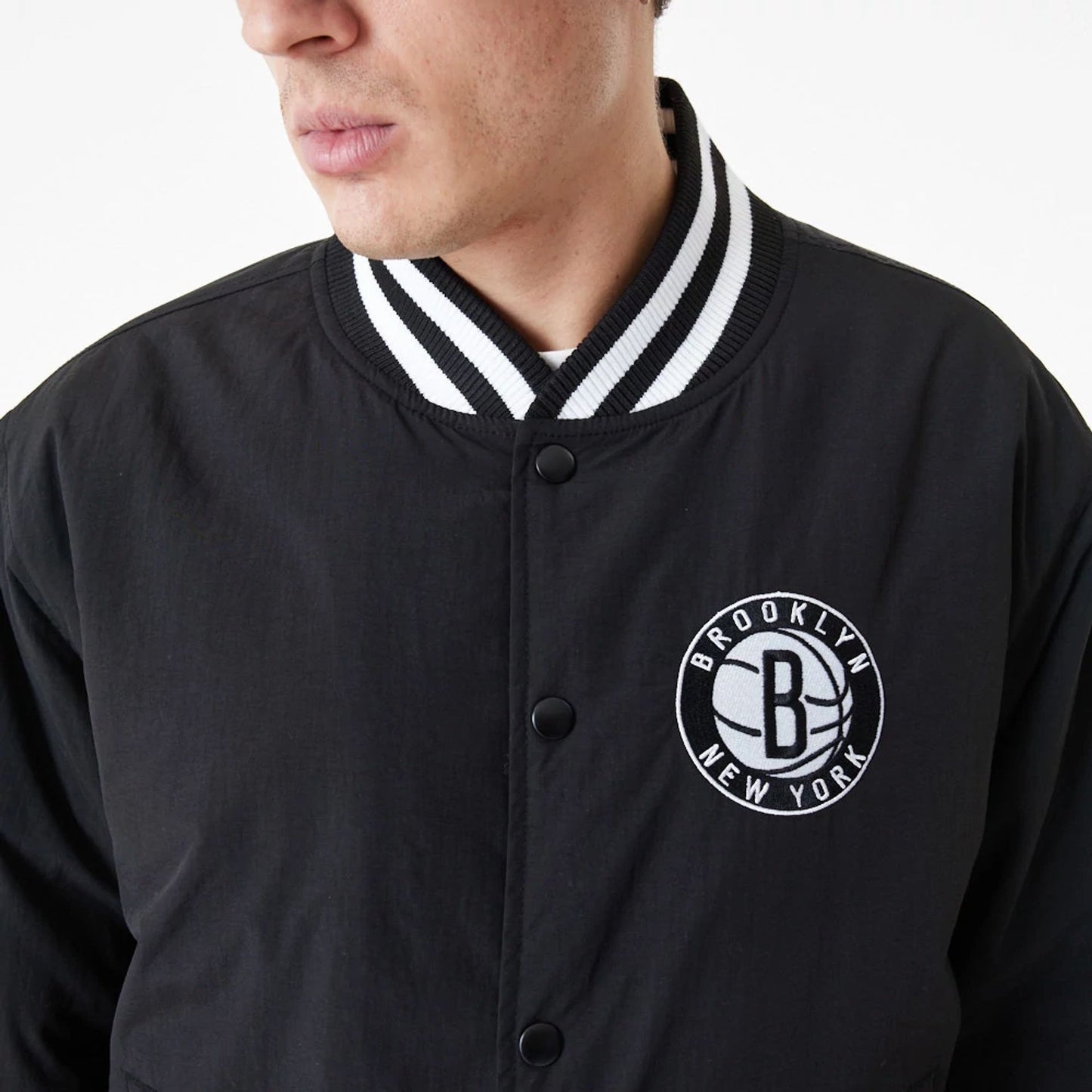 The Male model is wearing Brooklyn Nets Team Script Black Bomber Jacket 3