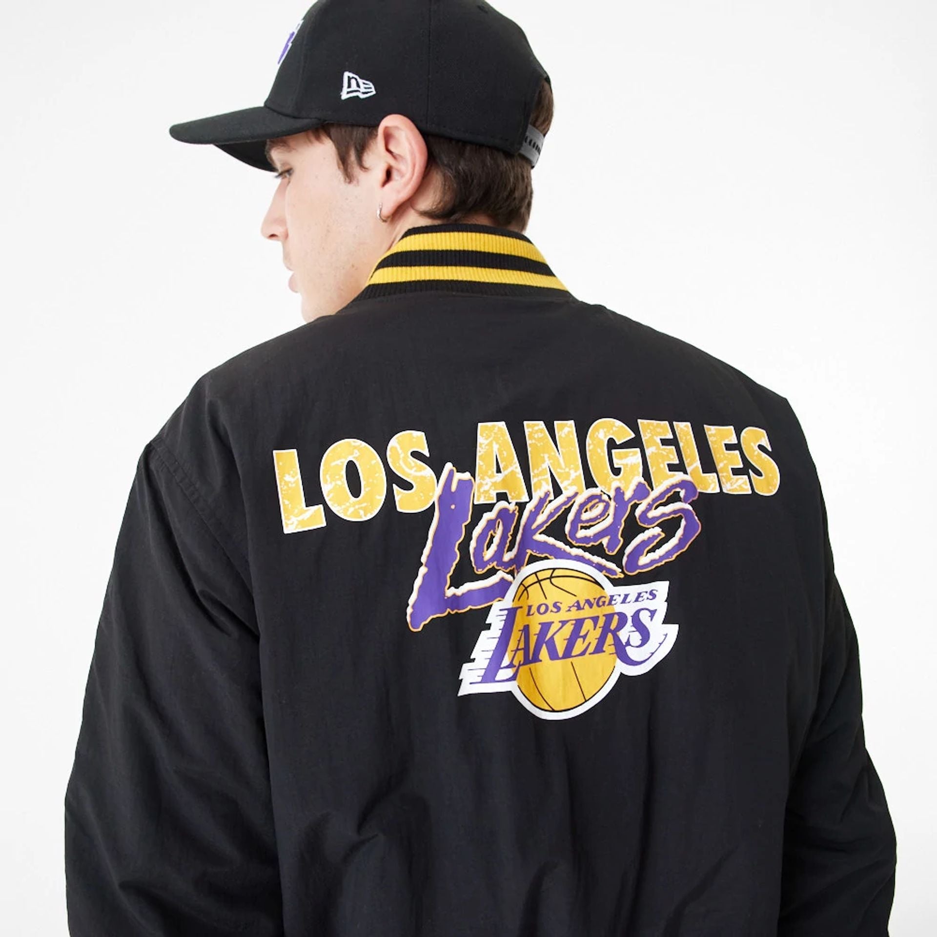 The Male model is wearing LA Lakers Team Script Black Bomber Jacket 4