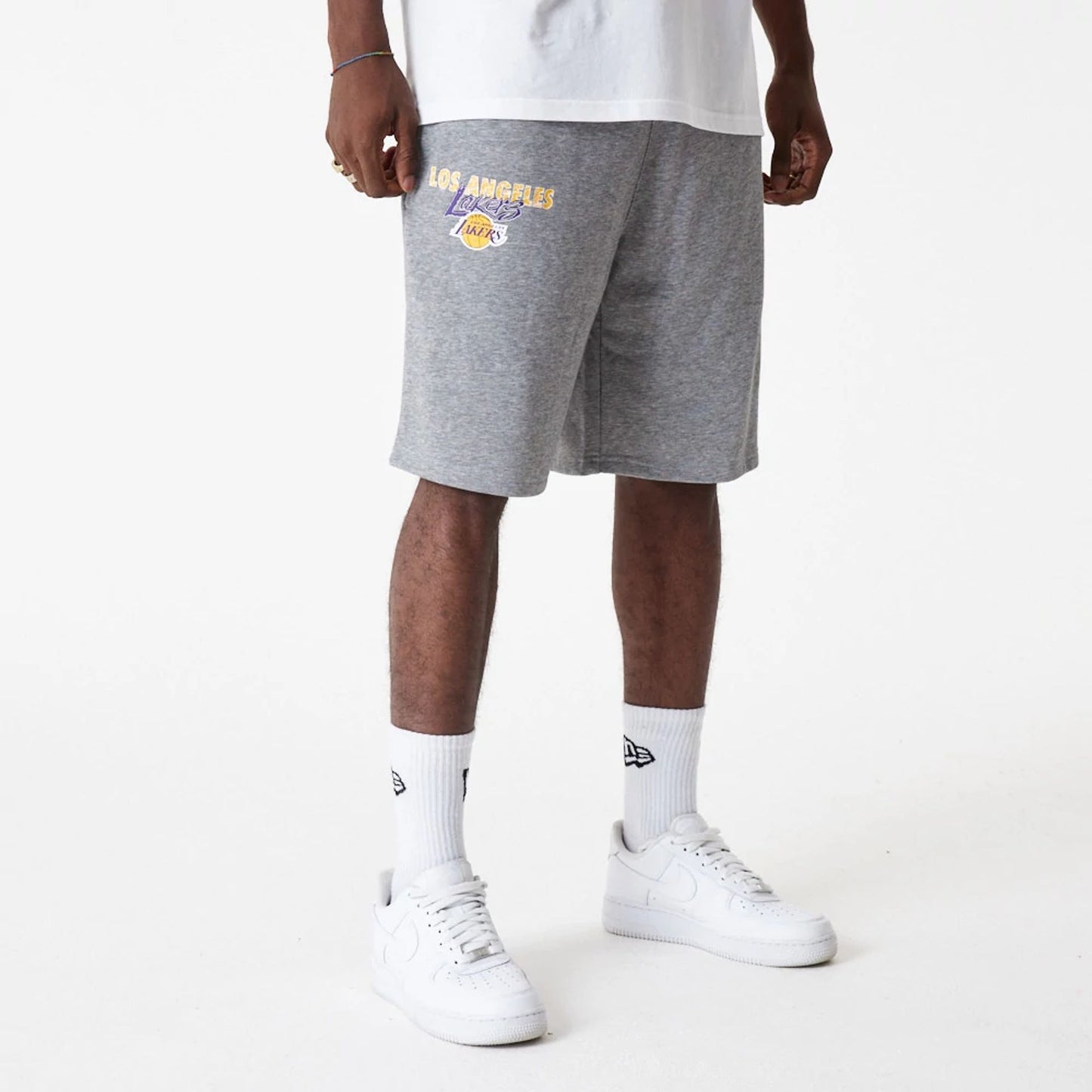 The Male model is wearing LA Lakers Team Script Grey Shorts 3