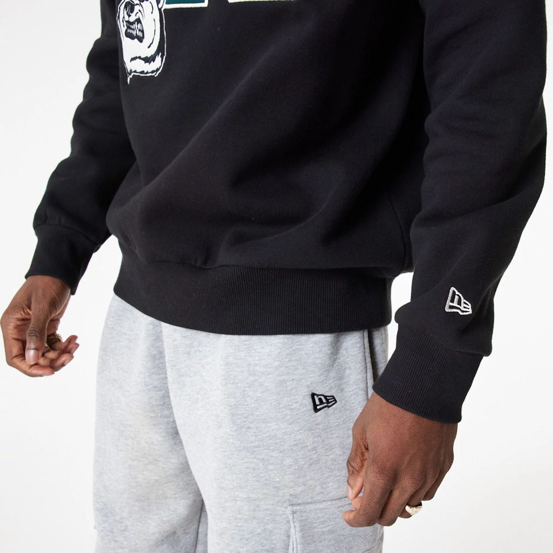 The Male model is wearing New Era Lifestyle Black Crew Neck Sweatshirt 2