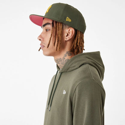 The Male model is wearing New Era Essential Green Pullover Hoodie 4