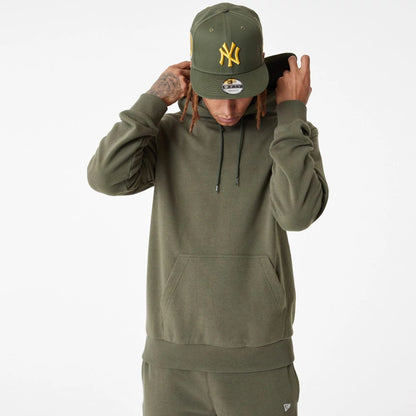 The Male model is wearing New Era Essential Green Pullover Hoodie 6