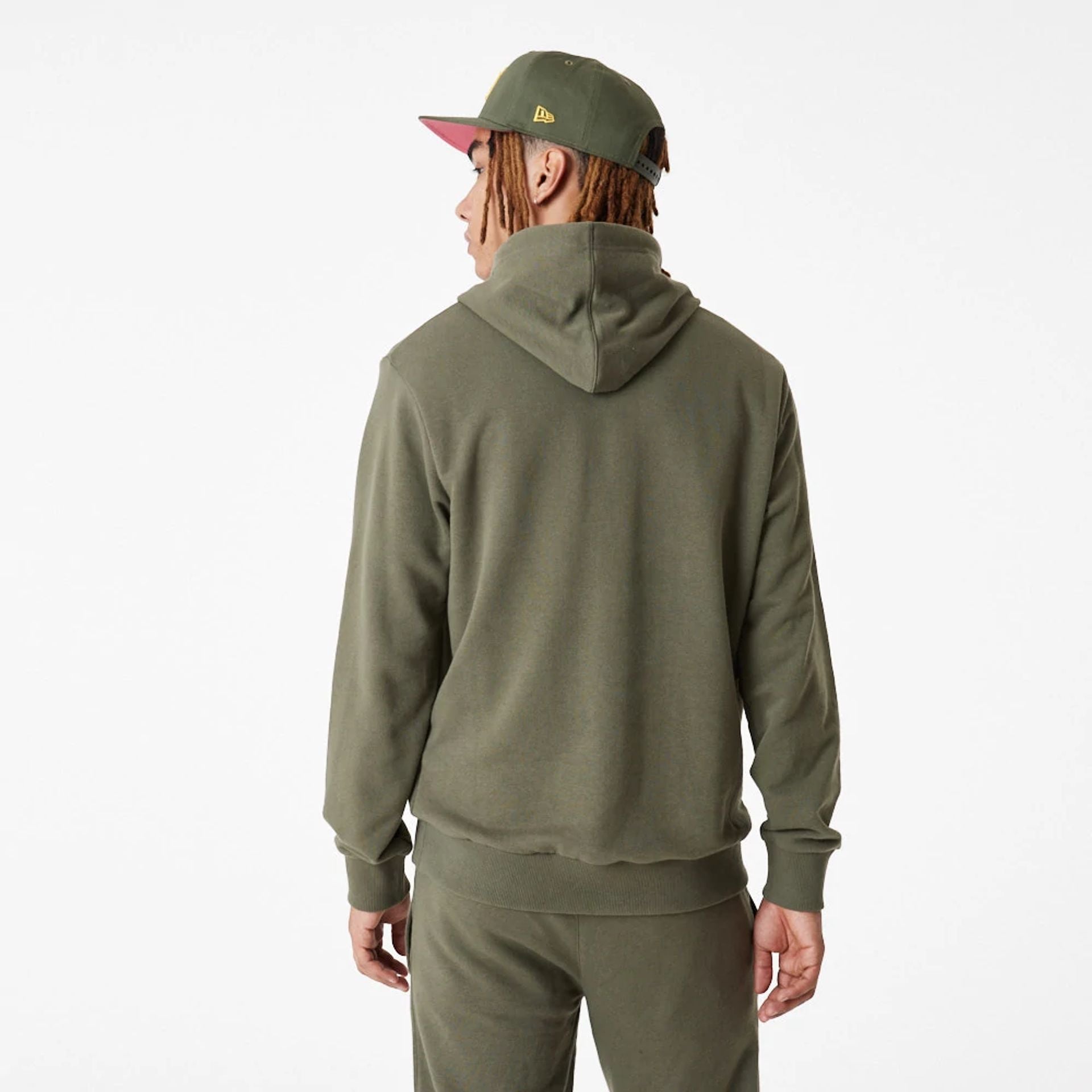 The Male model is wearing New Era Essential Green Pullover Hoodie 5