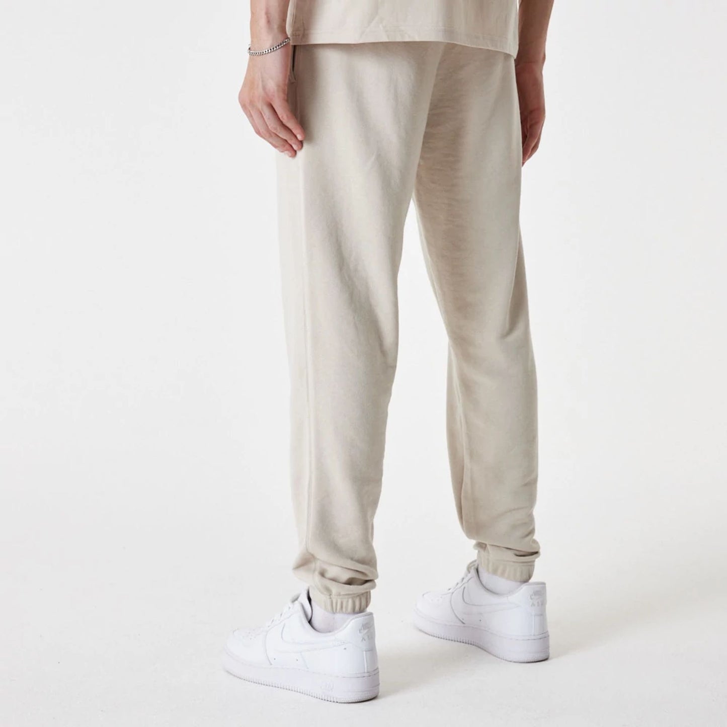 The Male model is wearing New Era Essential Stone Joggers 3