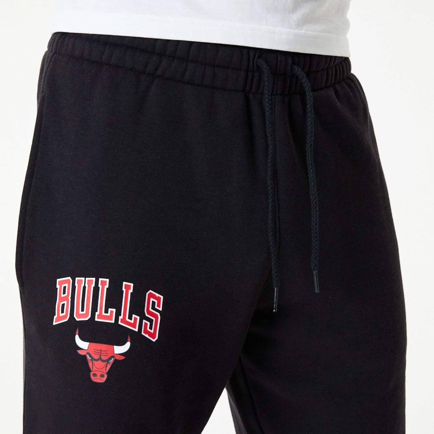 The Male model is wearing Chicago Bulls NBA Essential Black Joggers 6