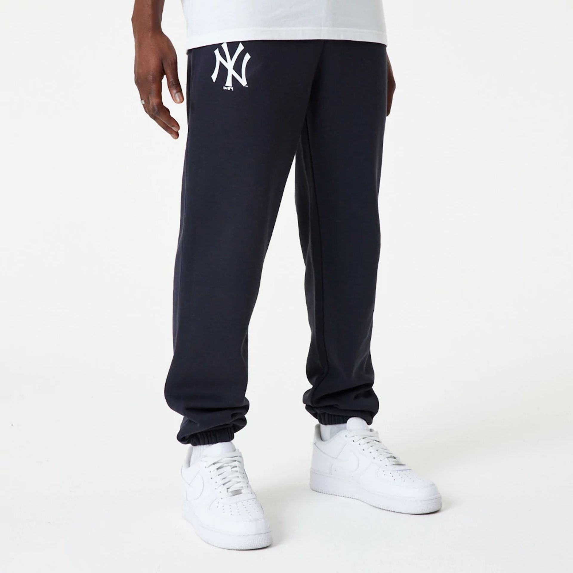 The Male model is wearing New York Yankees MLB Essential Navy Joggers 1