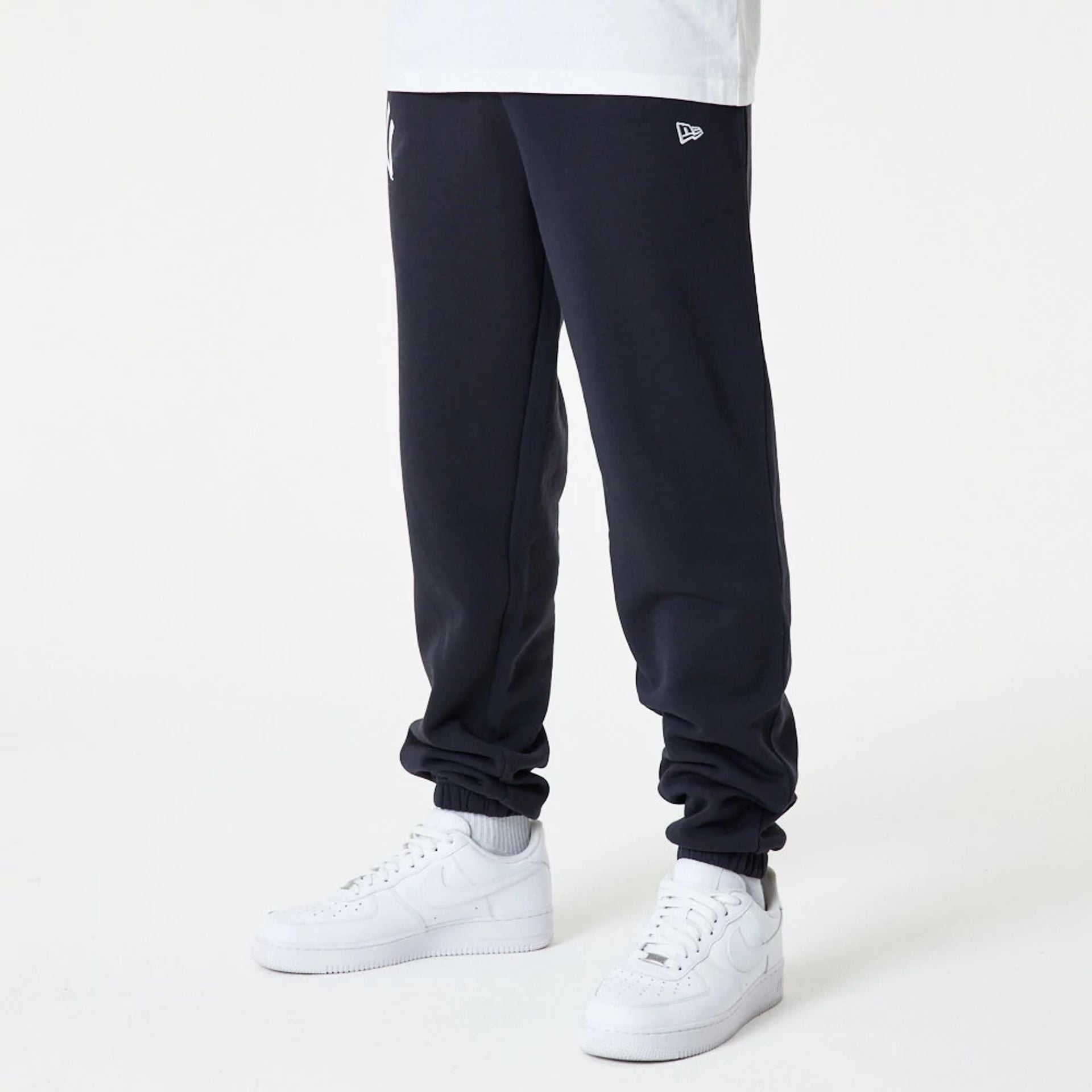 The Male model is wearing New York Yankees MLB Essential Navy Joggers 2