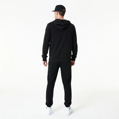 The Male model is wearing New Era Essential Black Pullover Hoodie 7