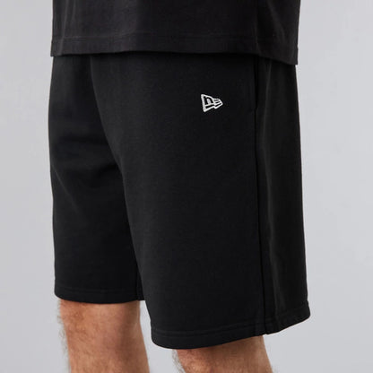 The Male model is wearing New Era Essential Black Shorts 4