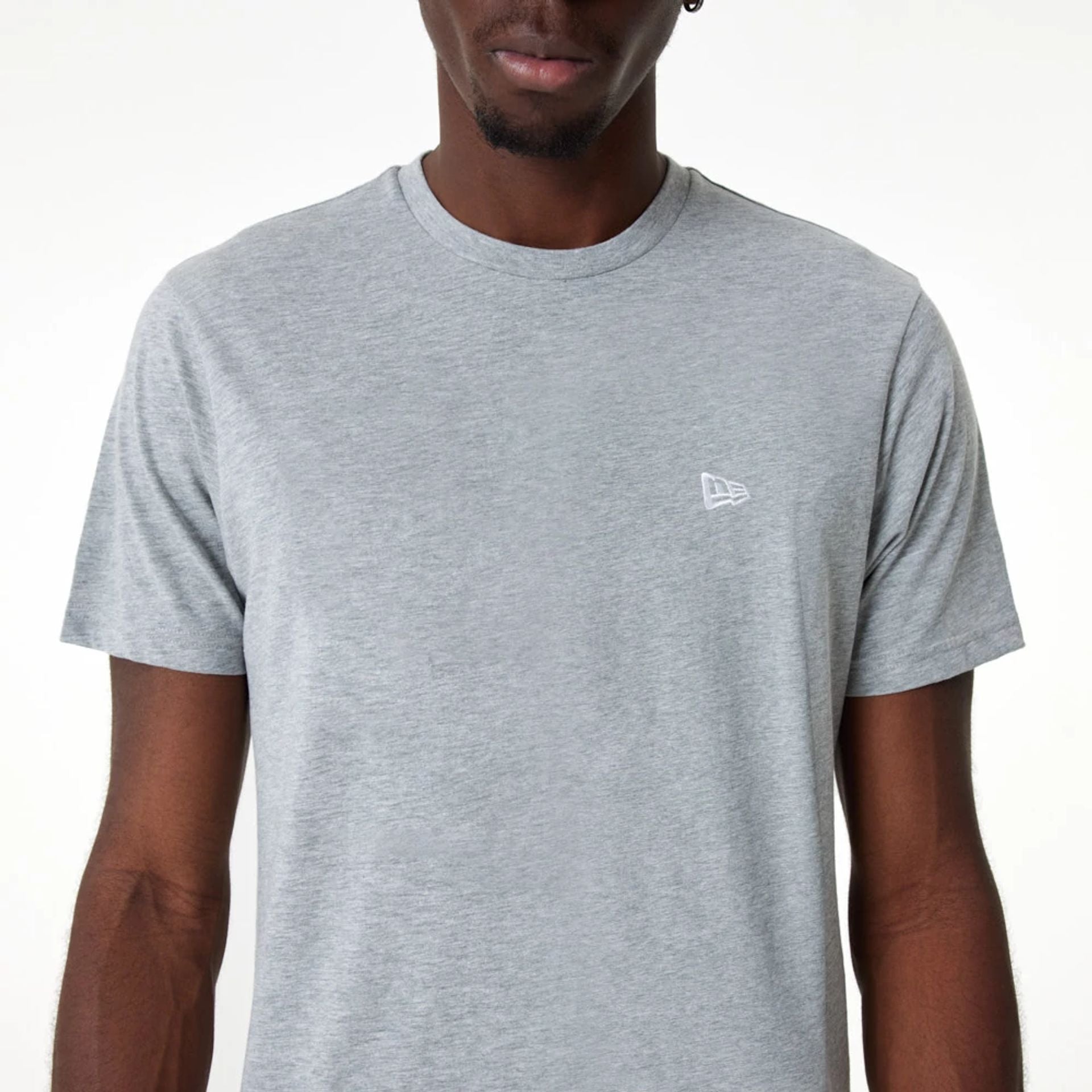 The Male model is wearing New Era Essential Grey T-Shirt 2