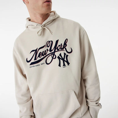 The Male model is wearing New York Yankees MLB Team Retro Graphic Light Beige Oversized Hoodie 5