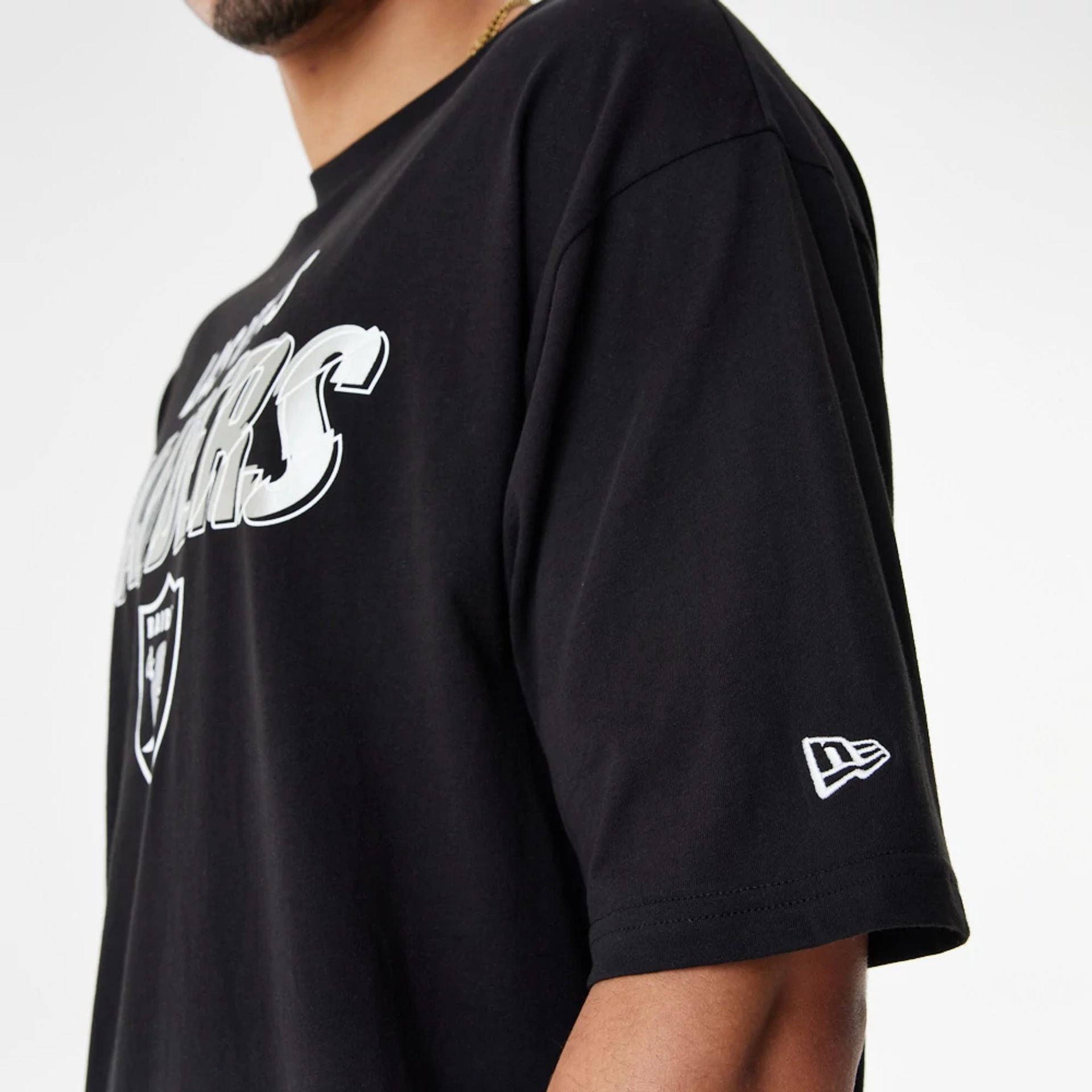 The Male model is wearing Las Vegas Raiders NFL Script Graphic Black Oversized T-Shirt 3