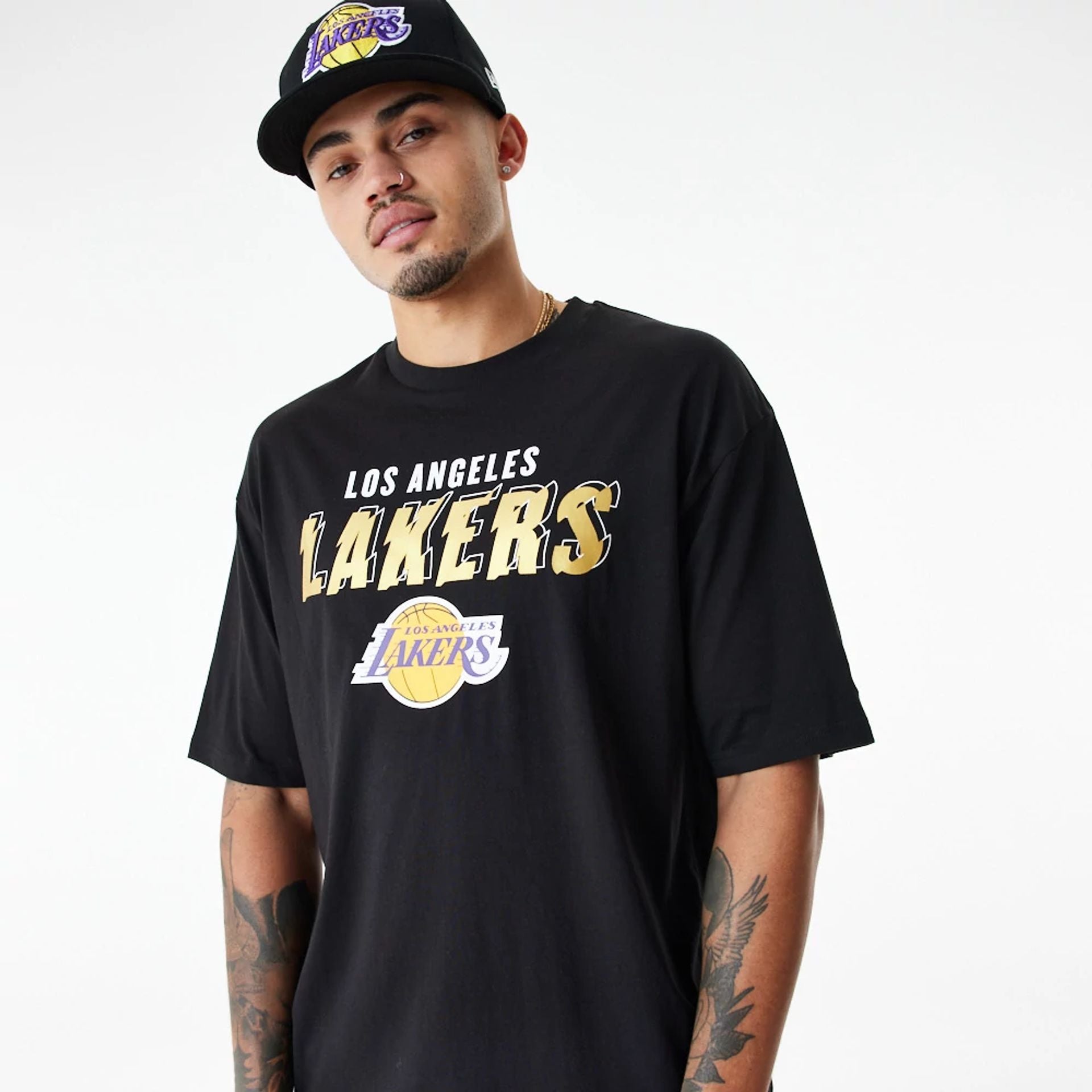 The Male model is wearing LA Lakers Team Script Black Oversized T-Shirt 2