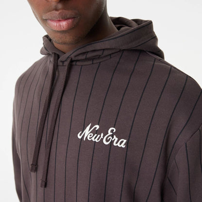 The Male model is wearing New Era Heritage Pinstripe Brown Oversized Hoodie 4