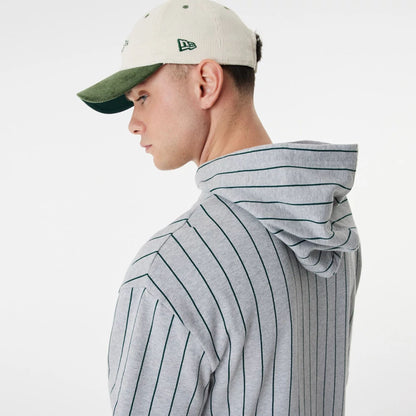 The Male model is wearing New Era Heritage Pinstripe Grey Oversized Hoodie 6