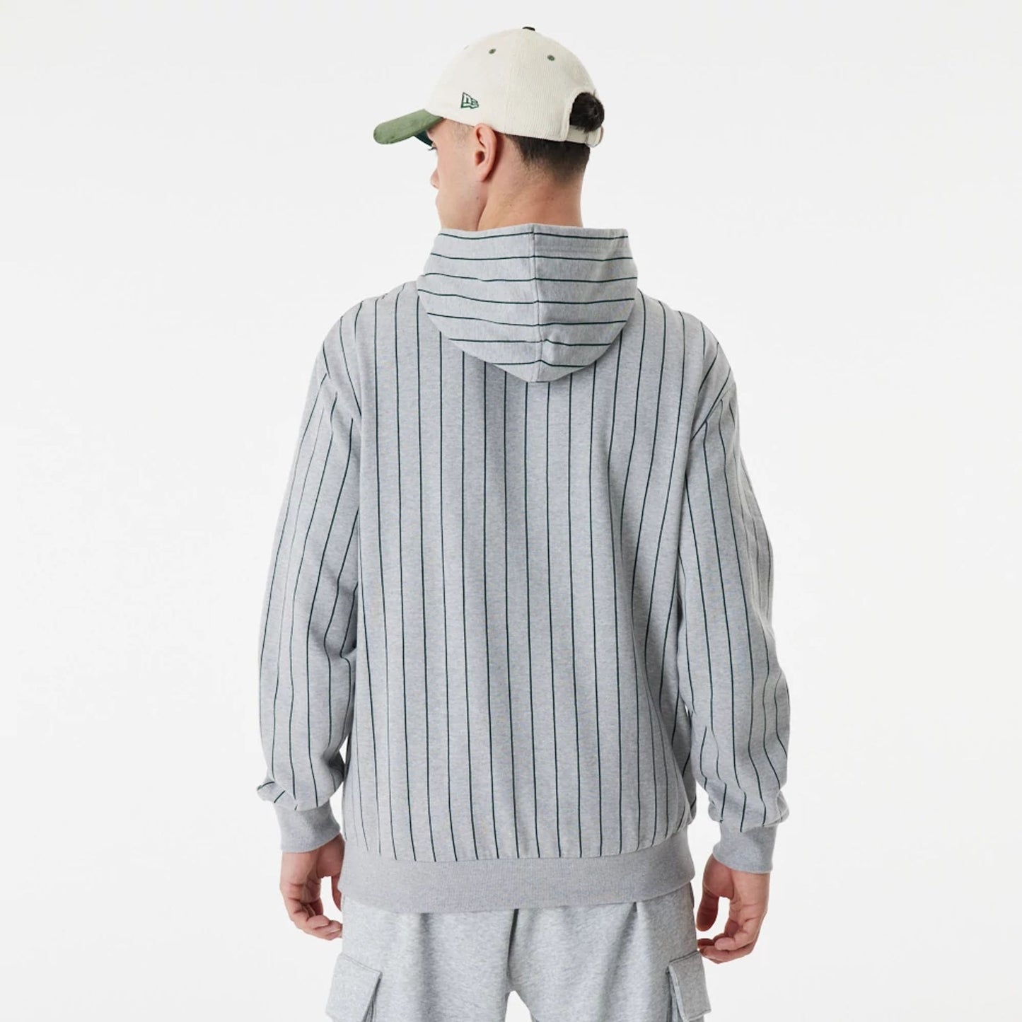 The Male model is wearing New Era Heritage Pinstripe Grey Oversized Hoodie 7