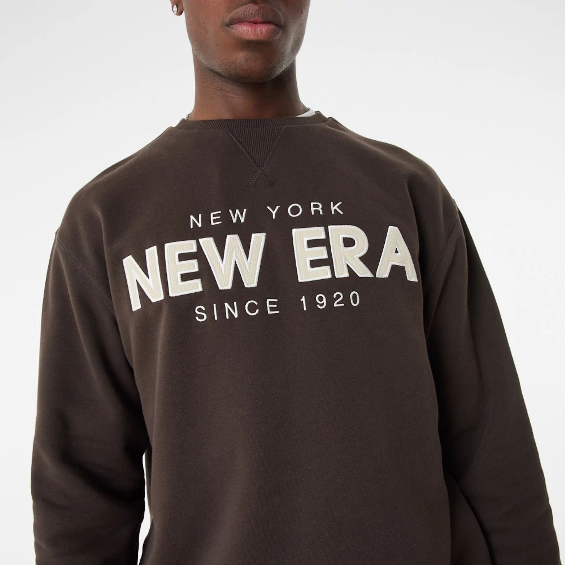 The Male model is wearing New Era Heritage Brown Crew Neck Sweatshirt 4