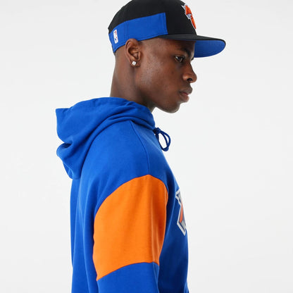 The Male model is wearing New York Knicks NBA Colour Block Blue Oversized Hoodie 5