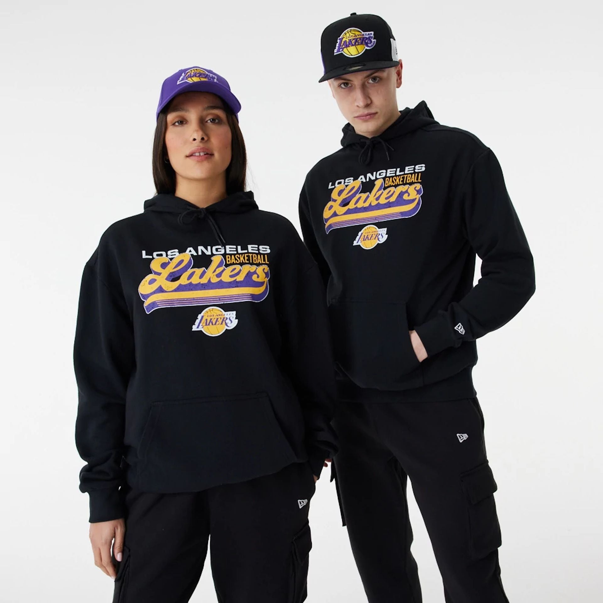 The Male model is wearing LA Lakers NBA Retro Graphic Black Oversized Hoodie 1