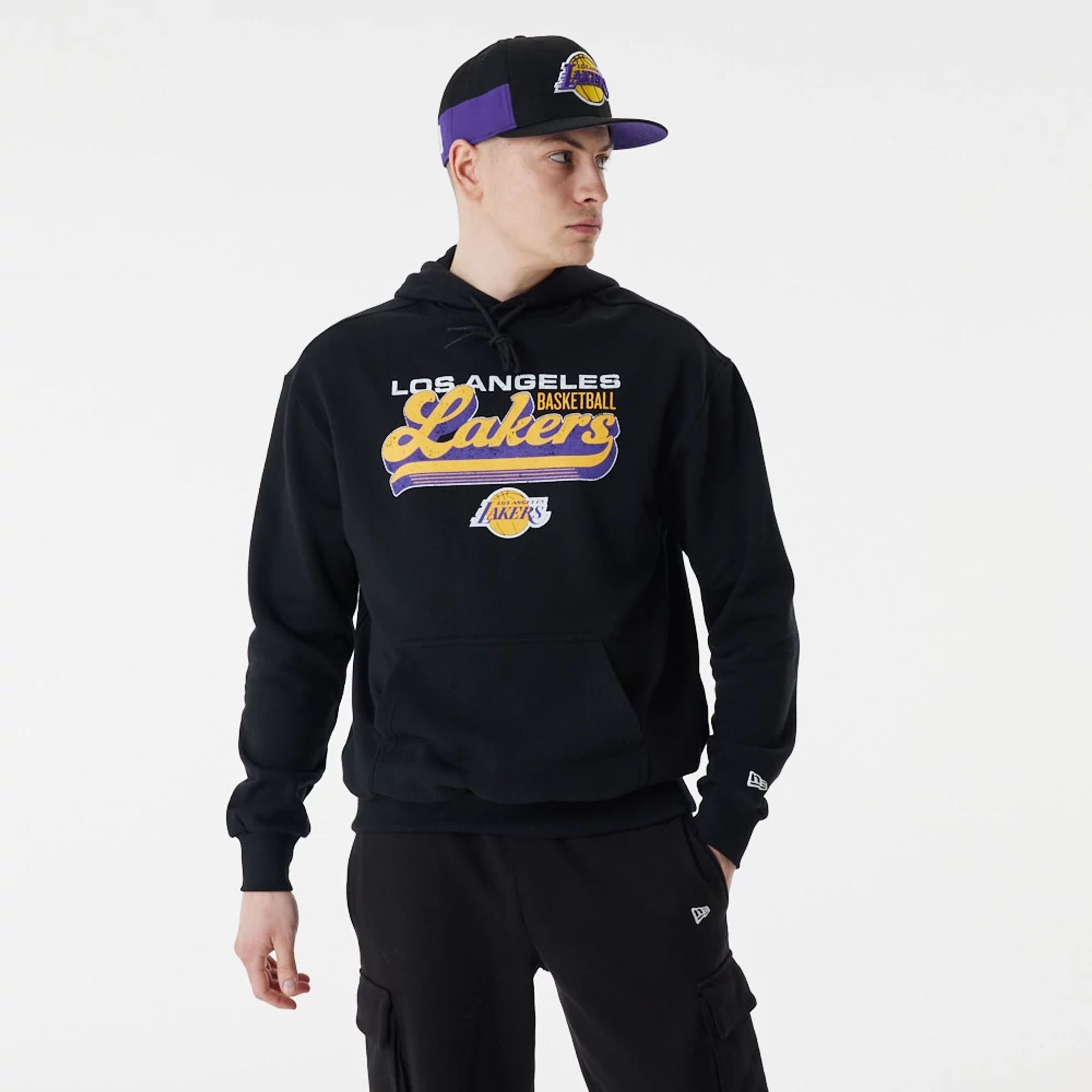 The Male model is wearing LA Lakers NBA Retro Graphic Black Oversized Hoodie 6