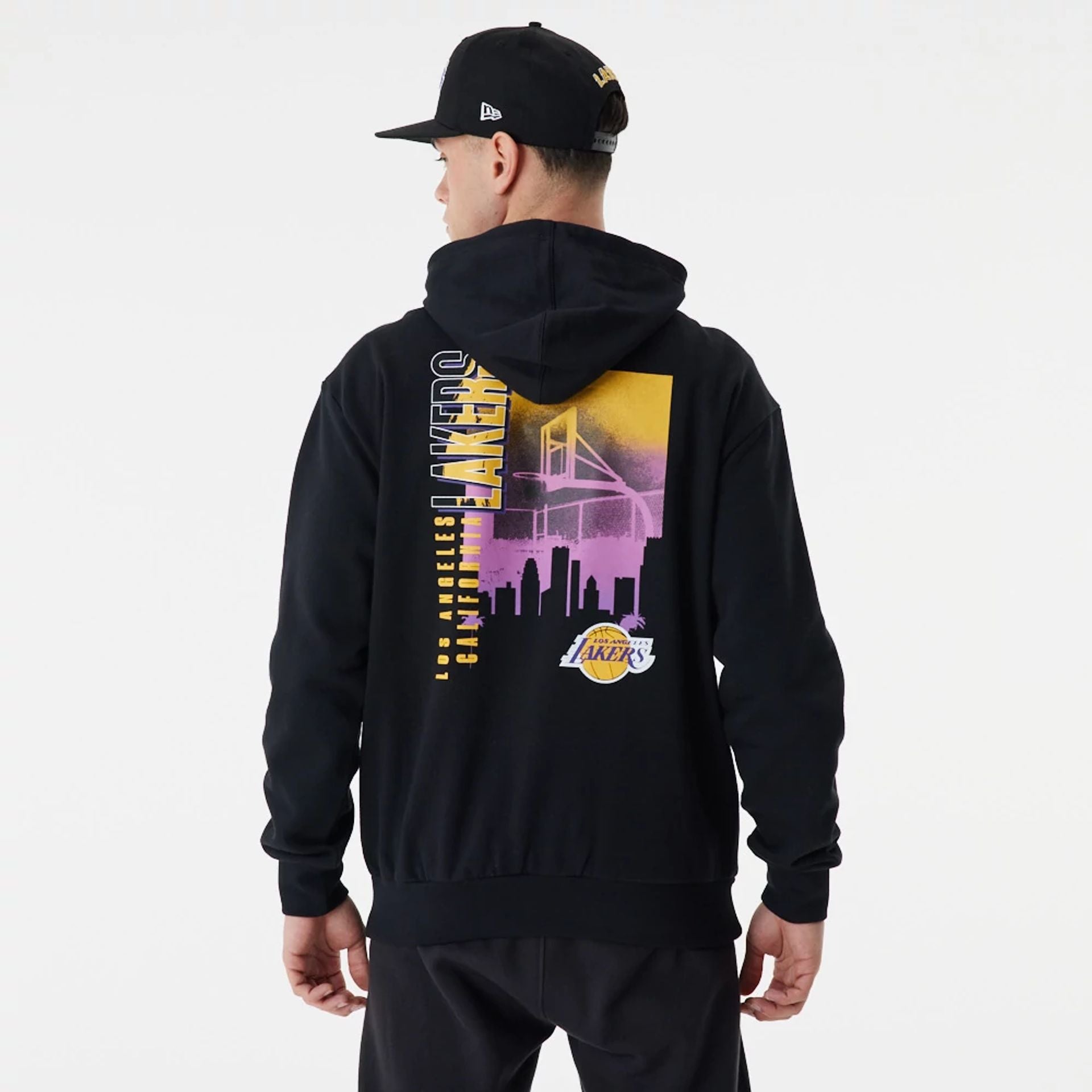 The Male model is wearing LA Lakers Skyline Graphic Black Oversized Hoodie 1