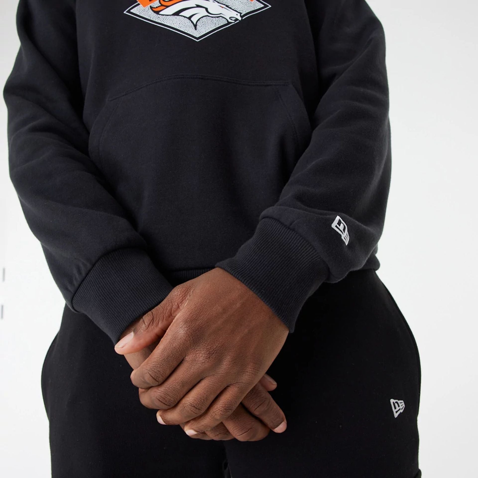 The Male model is wearing Denver Broncos NFL Team Graphic Black Pullover Hoodie 3