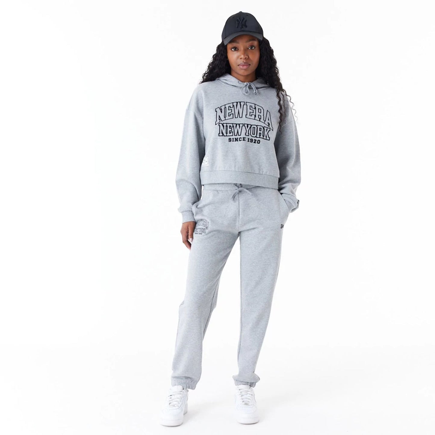 The Female model is wearing New Era Womens Arch Wordmark Grey Joggers 5