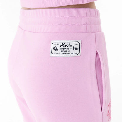 The Female model is wearing New Era Womens Arch Wordmark Pink Joggers 8