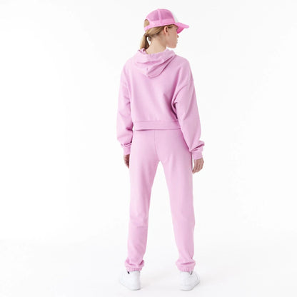 The Female model is wearing New Era Womens Arch Wordmark Pink Joggers 3