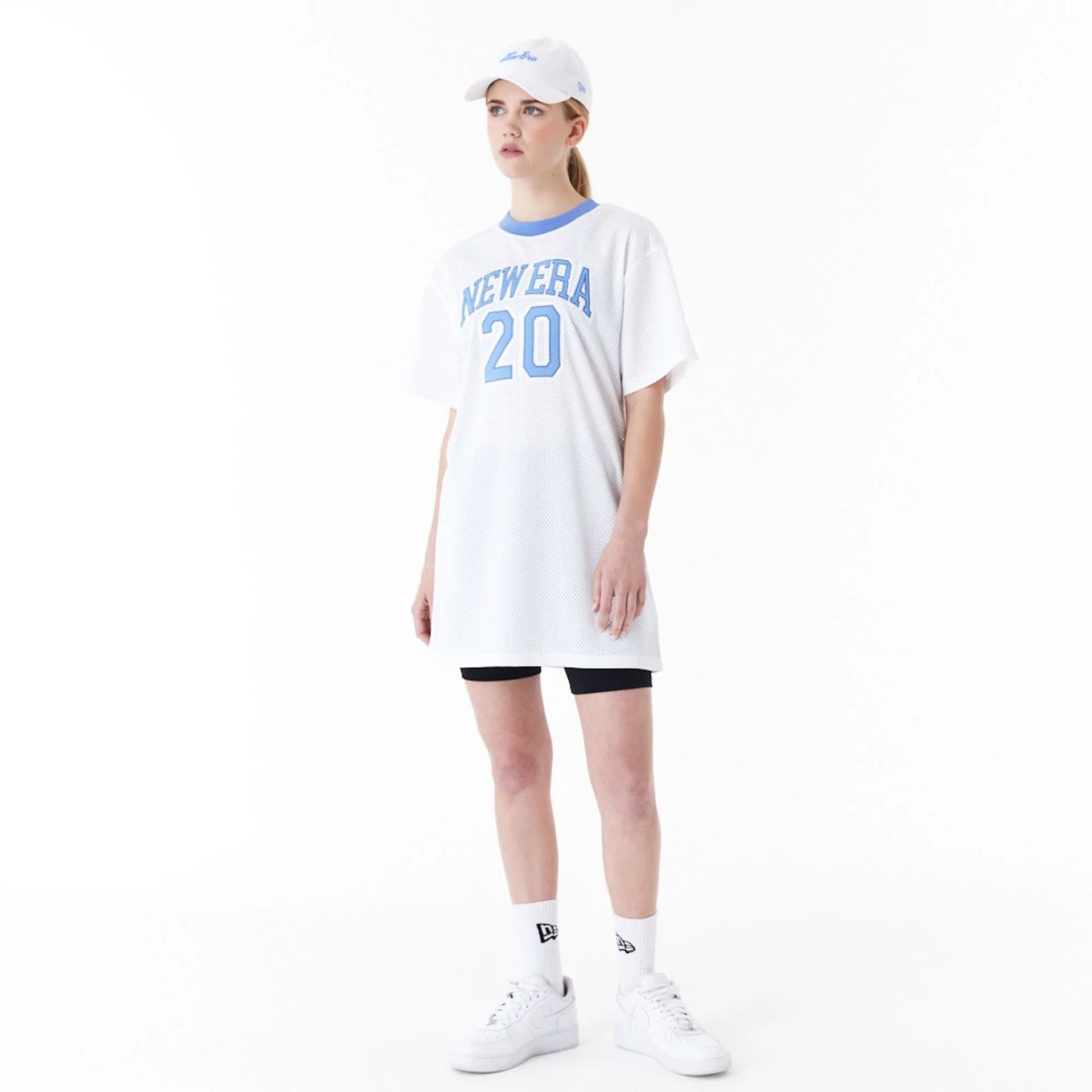 The Female model is wearing New Era Womens Arch Wordmark White Mesh Dress 4