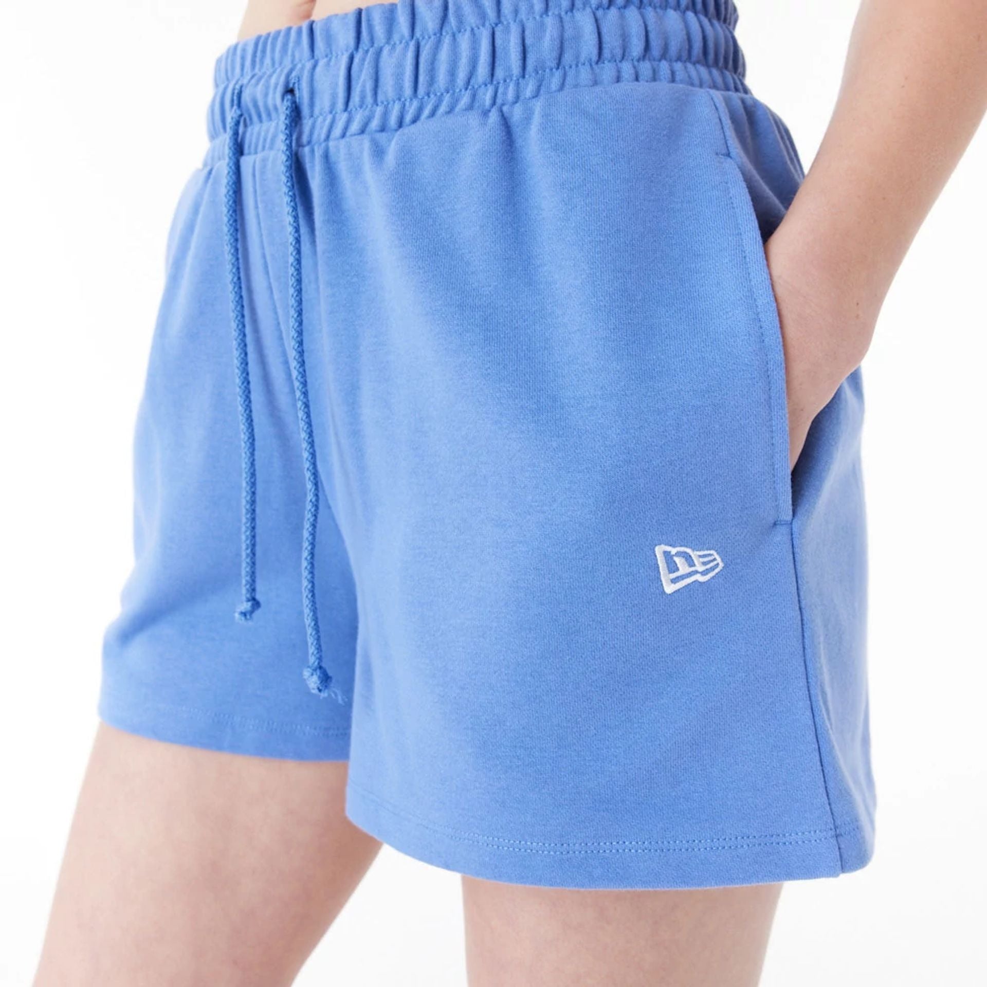 The Female model is wearing New Era Blue Womens Sweat Shorts 9