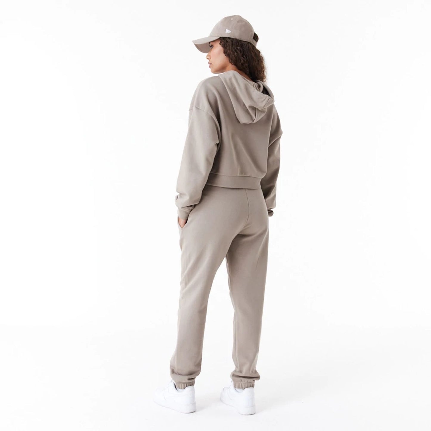 The Female model is wearing New Era Womens Arch Wordmark Brown Joggers 3