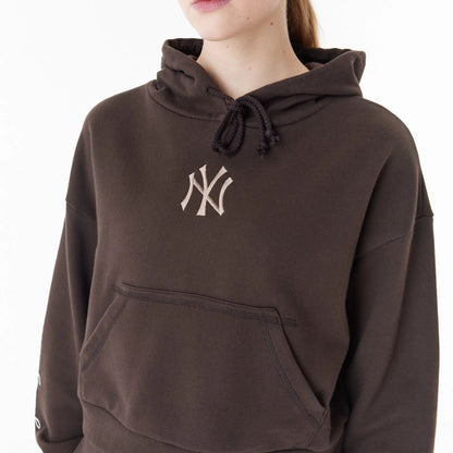 The Female model is wearing New York Yankees MLB Lifestyle Brown Womens Crop Pullover Hoodie 7