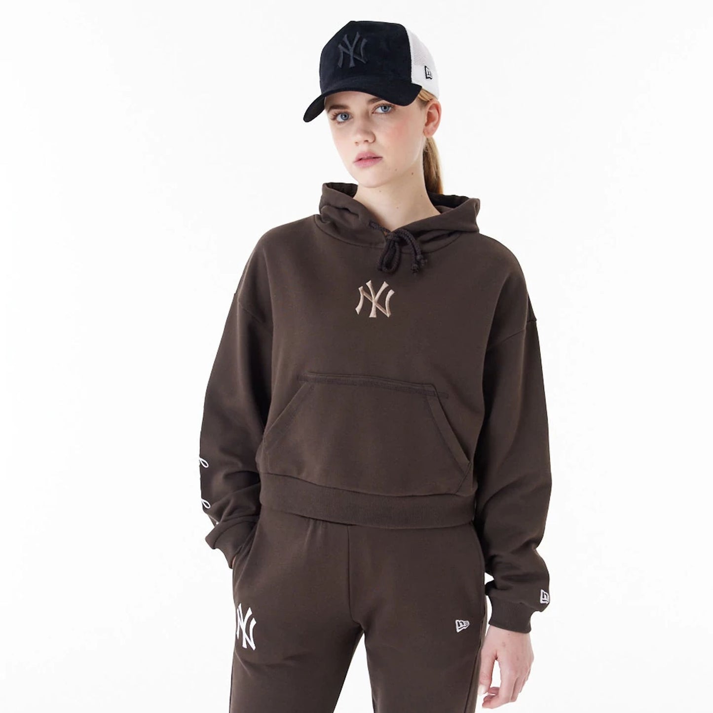 The Female model is wearing New York Yankees MLB Lifestyle Brown Womens Crop Pullover Hoodie 1