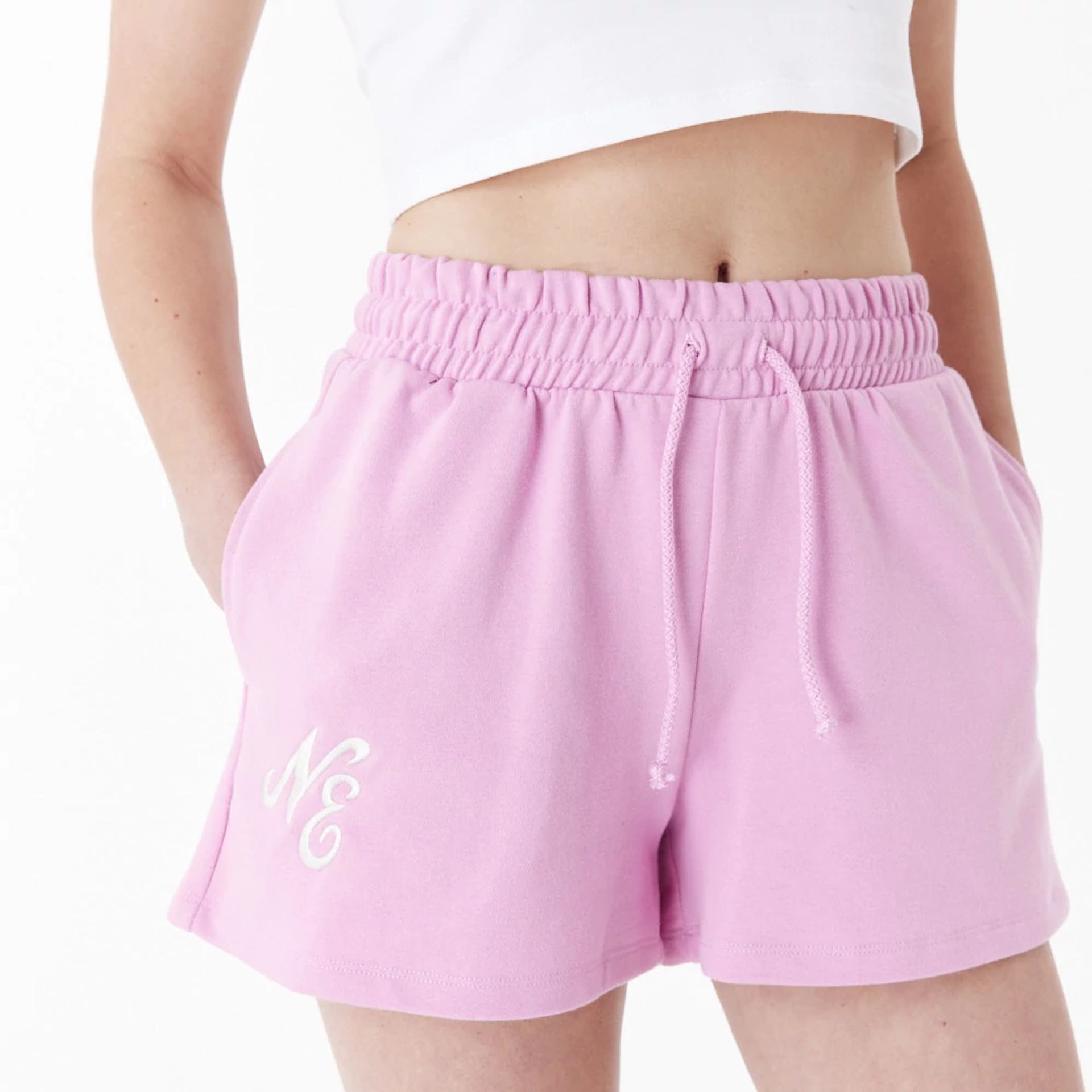 The Female model is wearing New Era Pink Womens Sweat Shorts 7